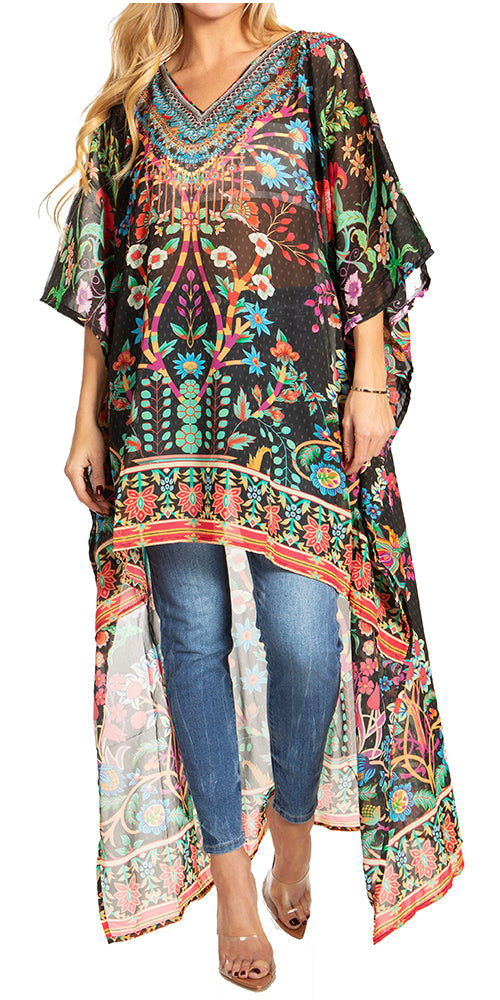 Woman wearing a colorful patterned dress over jeans on a white background