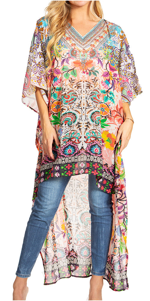 Woman wearing a colorful floral kimono over jeans