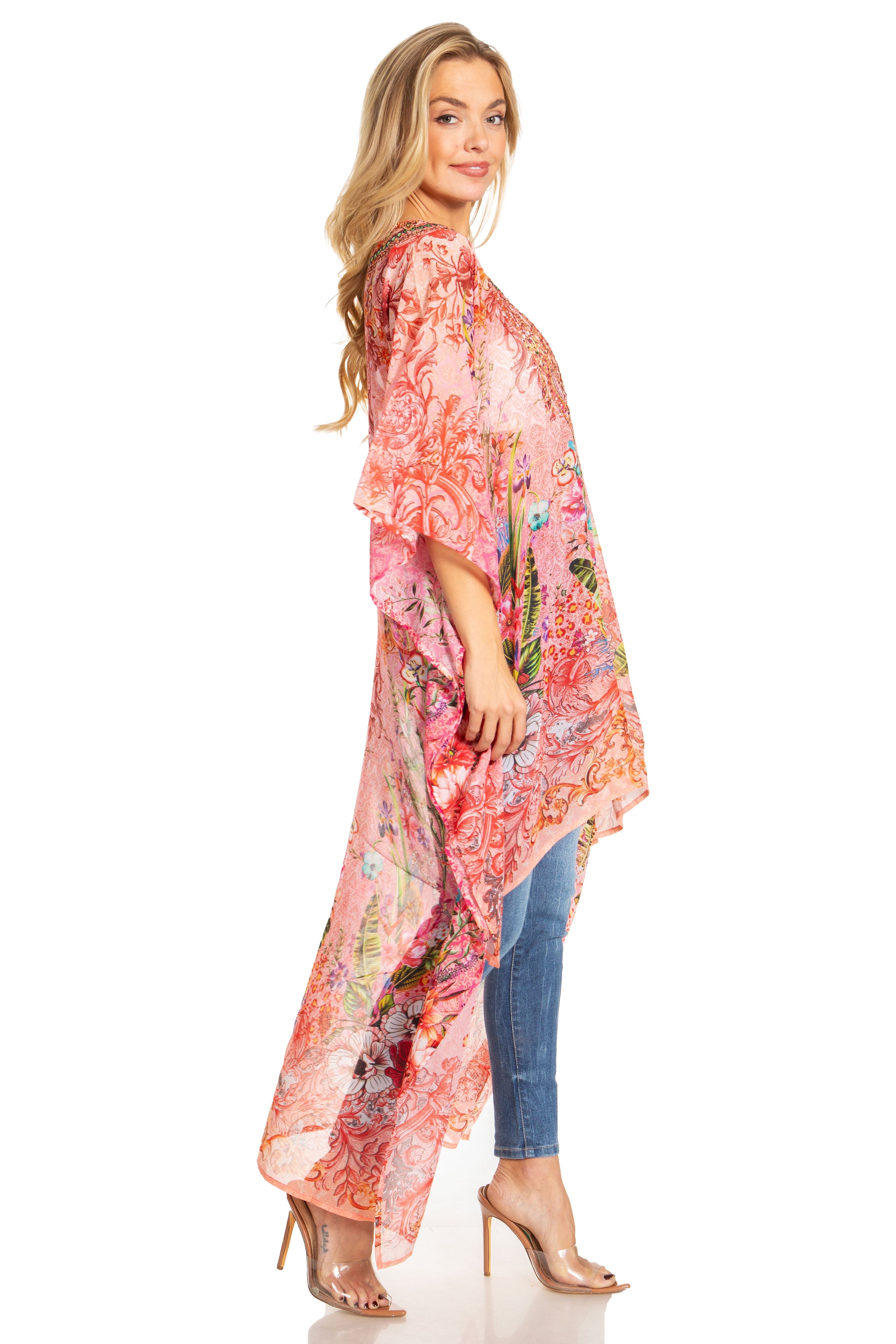 Woman wearing a floral kimono over a dress on a white background