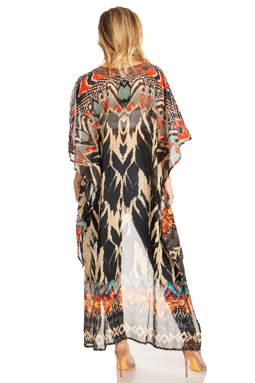 Woman wearing a long, patterned dress with a white background