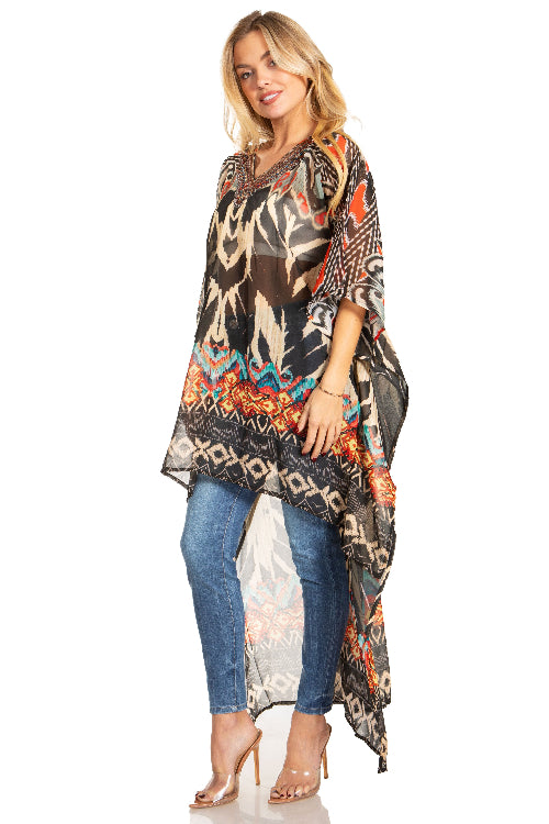 Woman wearing a patterned long top and jeans on a white background