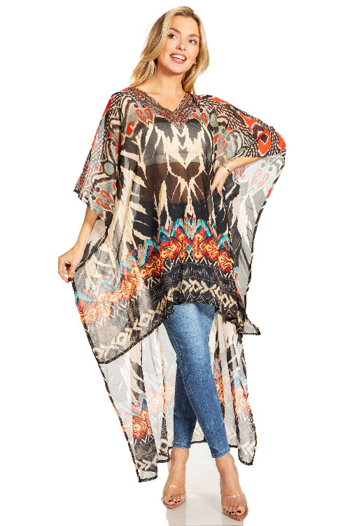 Woman wearing a colorful patterned kaftan over blue jeans on a white background