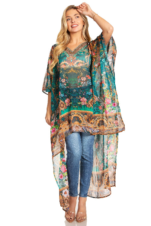 Woman wearing a colorful floral dress with a sheer overlay on a white background
