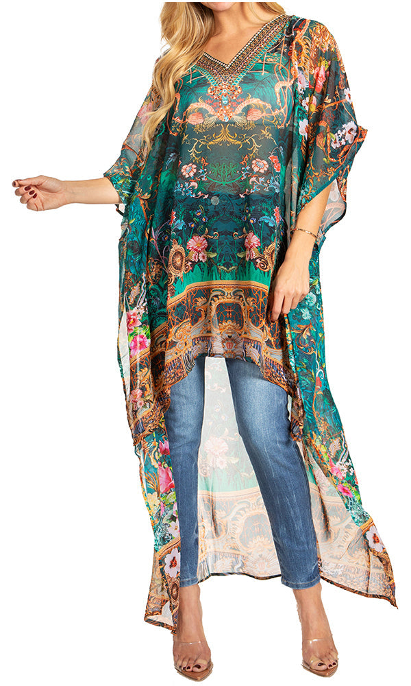 Woman wearing a long, patterned kimono-style garment over jeans on a white background