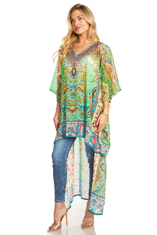 Woman wearing a colorful patterned dress over jeans on a white background