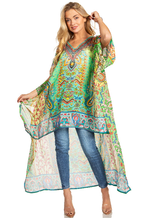 Woman wearing a colorful patterned dress over jeans on a white background