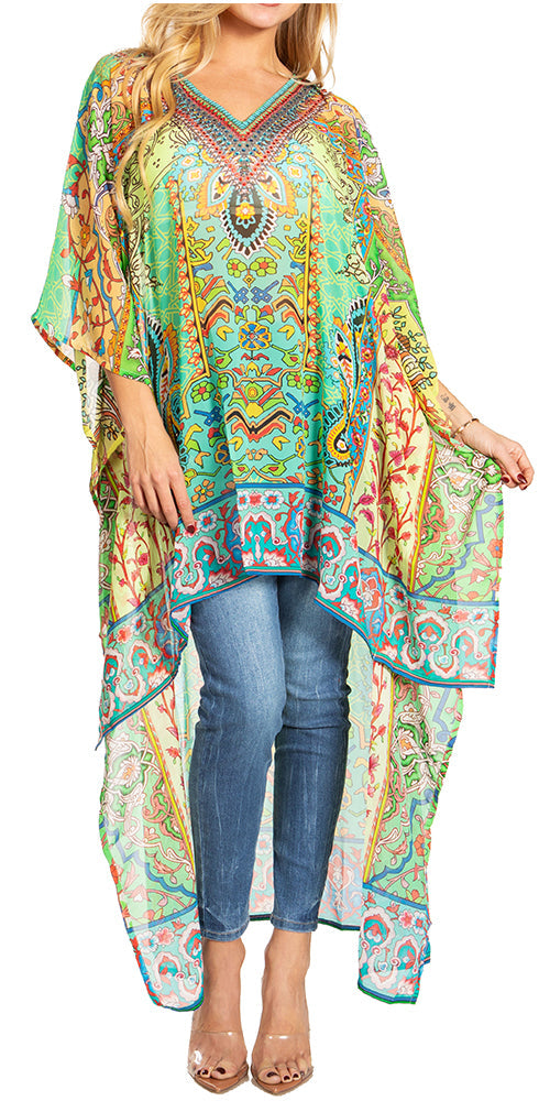 Woman wearing a colorful patterned kaftan over jeans on a white background