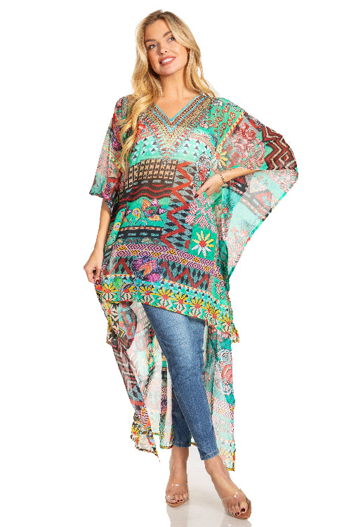 Woman wearing a colorful patterned dress over jeans on a white background