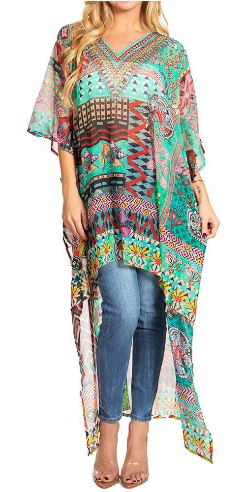 Woman wearing a colorful patterned kaftan over jeans on a white background