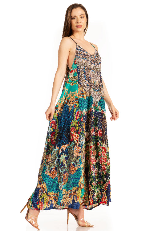 Woman wearing a colorful patterned dress on a white background