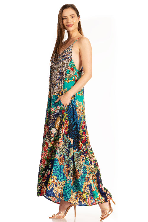 Woman wearing a colorful patterned dress on a white background