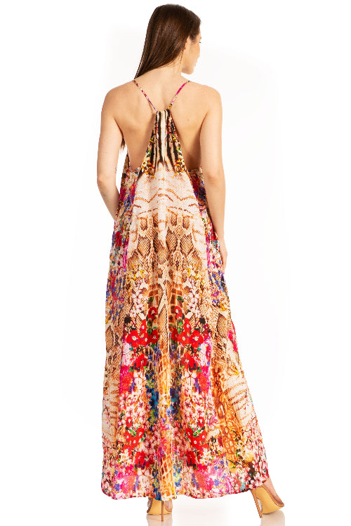 Woman wearing a colorful floral dress on a white background