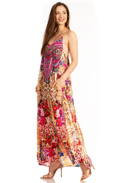 Woman wearing a colorful floral dress on a white background