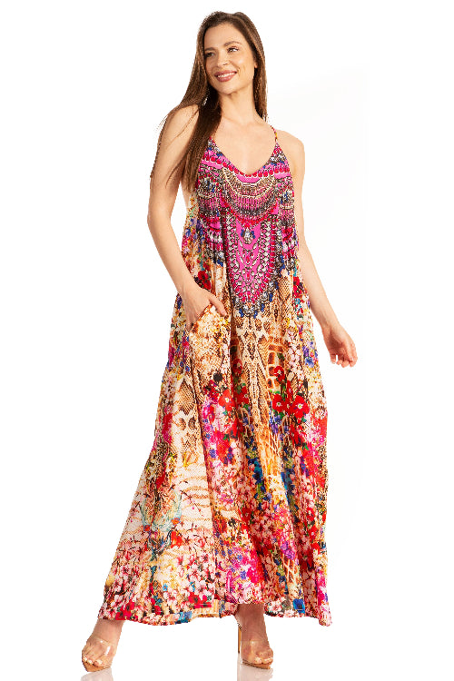 Woman wearing a colorful floral dress on a white background
