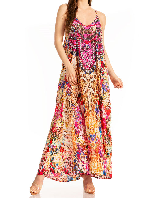 Woman wearing a colorful patterned dress on a white background