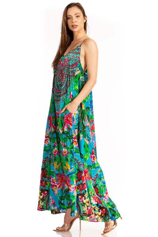 Woman wearing a colorful floral dress on a white background