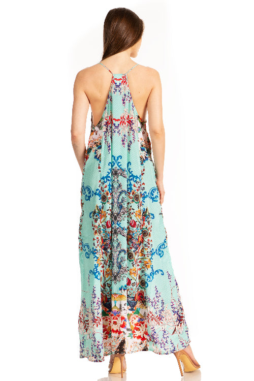 Woman wearing a colorful floral dress on a white background