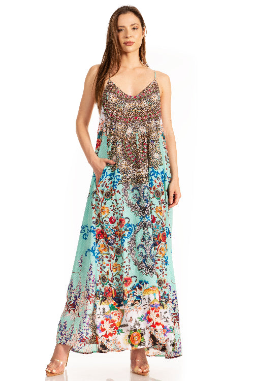 Woman wearing a colorful floral dress on a white background