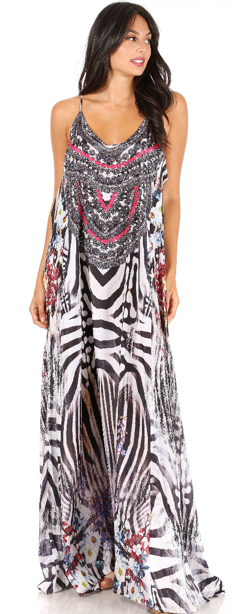 Woman wearing a long, patterned dress against a white background