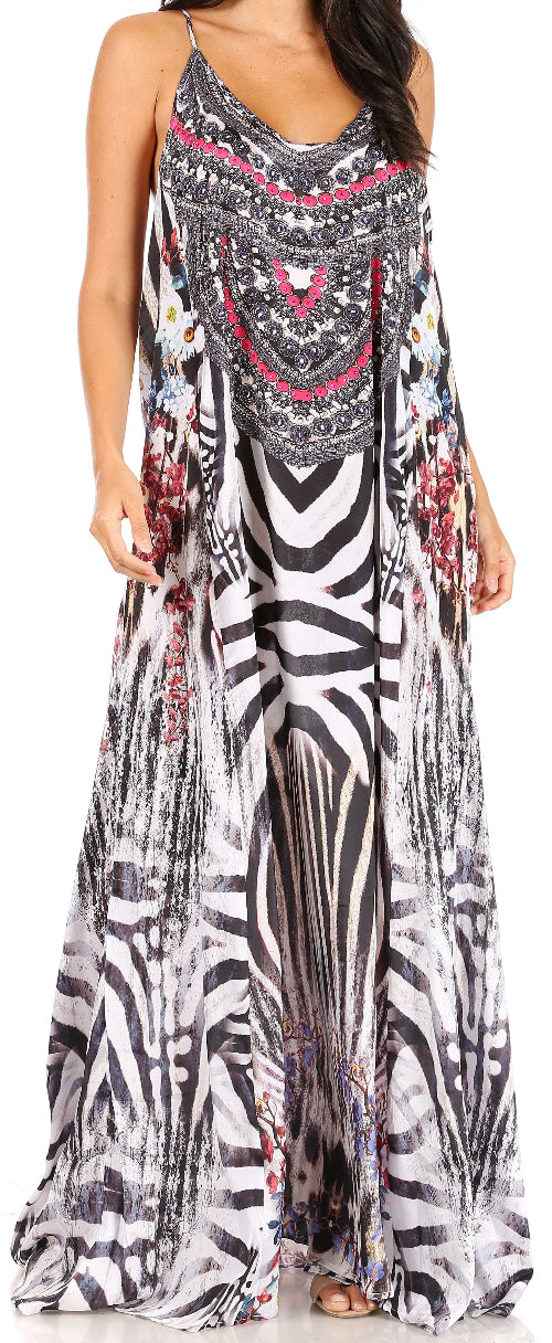 Woman wearing a long, patterned dress with a mix of black, white, and pink colors.