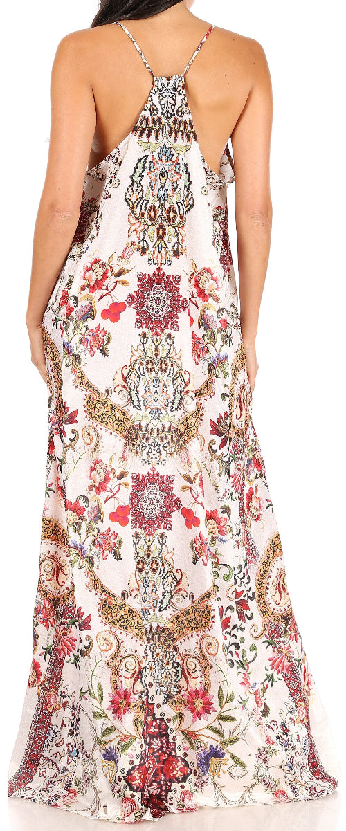 Woman wearing a floral and paisley patterned dress with thin straps.