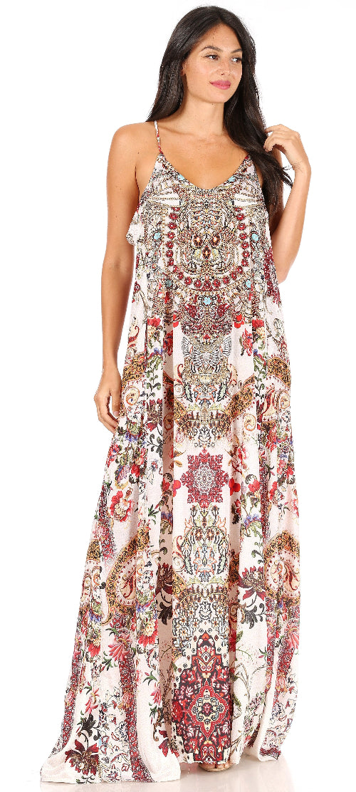 Woman wearing a long, patterned dress on a white background