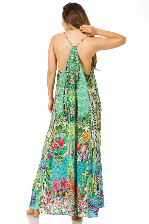 Woman wearing a colorful floral dress on a white background