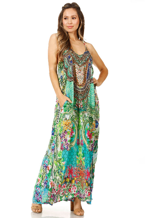 Woman wearing a colorful floral and paisley patterned dress on a white background