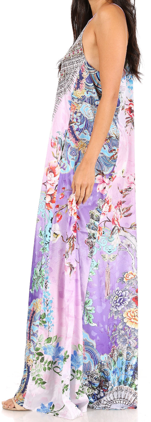 Woman wearing a colorful floral dress with a sleeveless design.