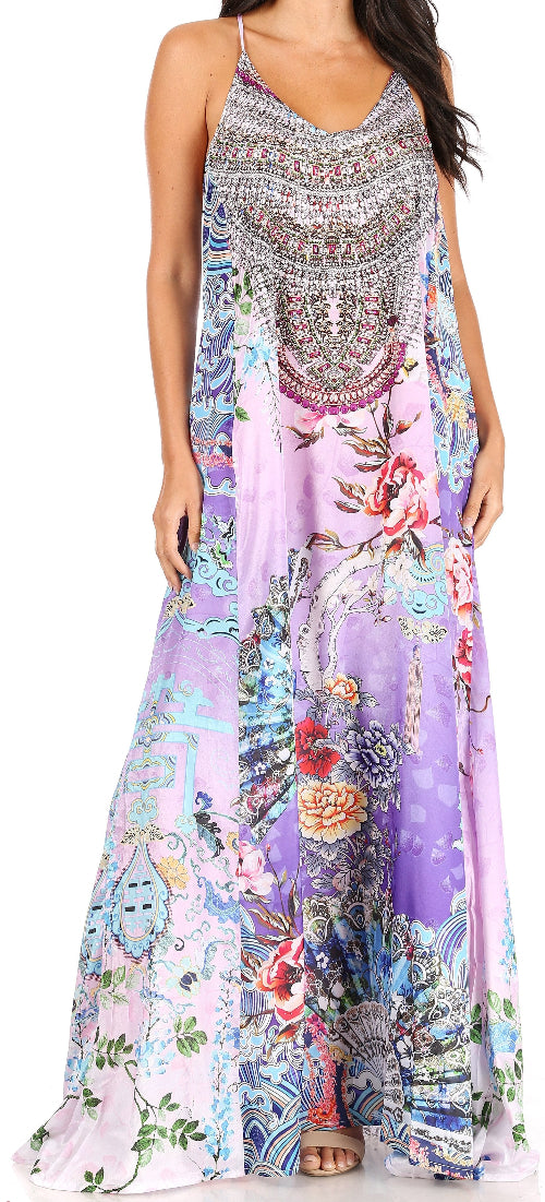 Woman wearing a colorful floral and beaded dress on a white background