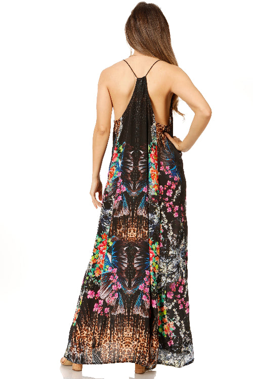 Woman wearing a floral and abstract patterned dress on a white background