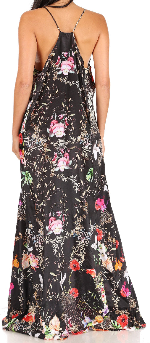 Woman wearing a floral maxi dress with a black background