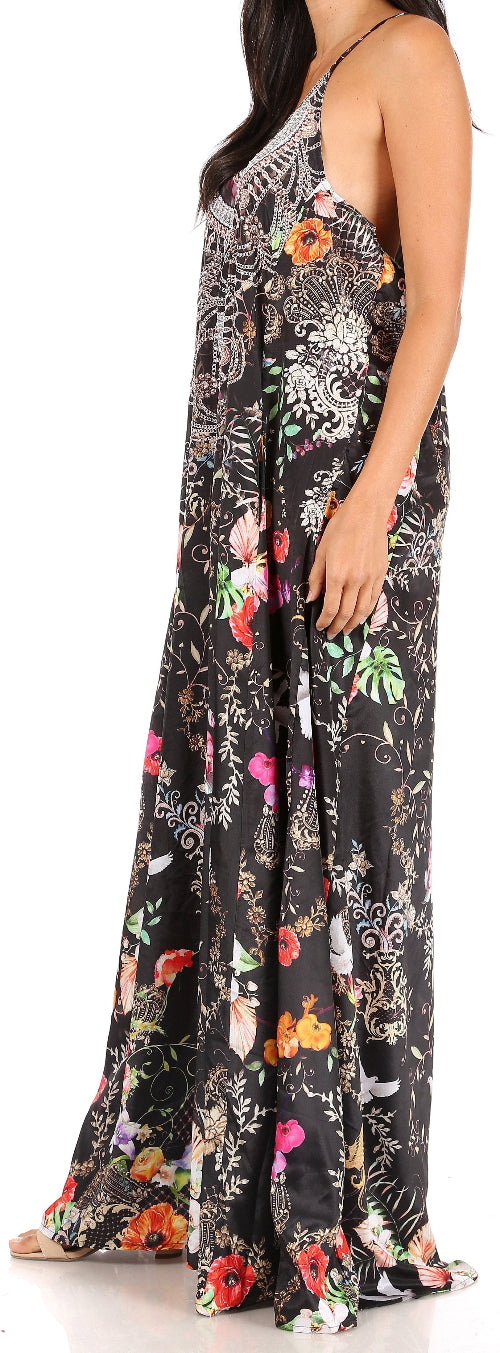 Woman wearing a floral maxi dress with a black background