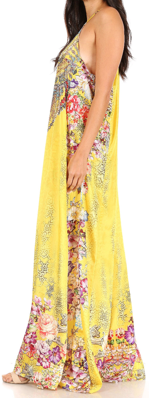 Woman wearing a yellow floral dress with a white background