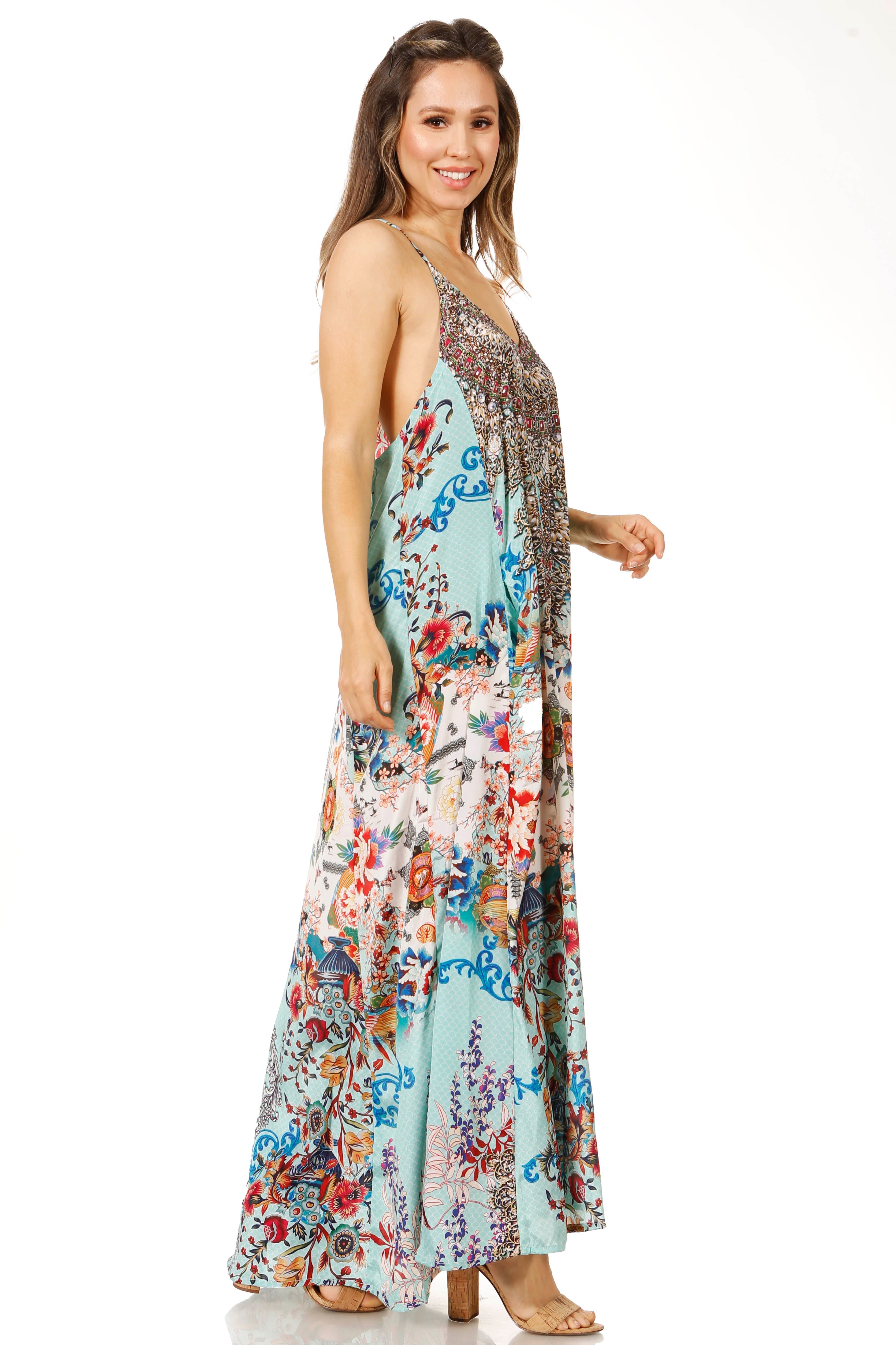 Woman wearing a floral maxi dress on a white background