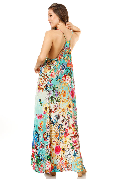 Woman wearing a colorful floral dress on a white background