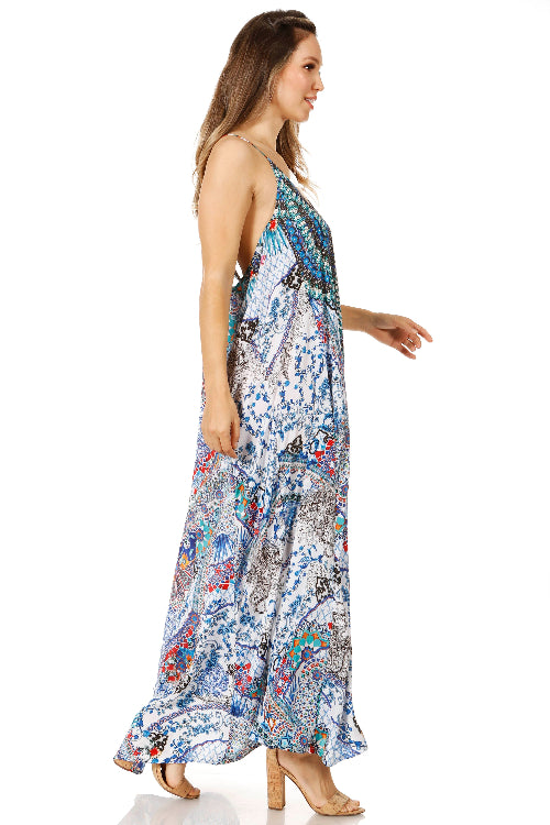 Woman wearing a colorful patterned dress on a white background
