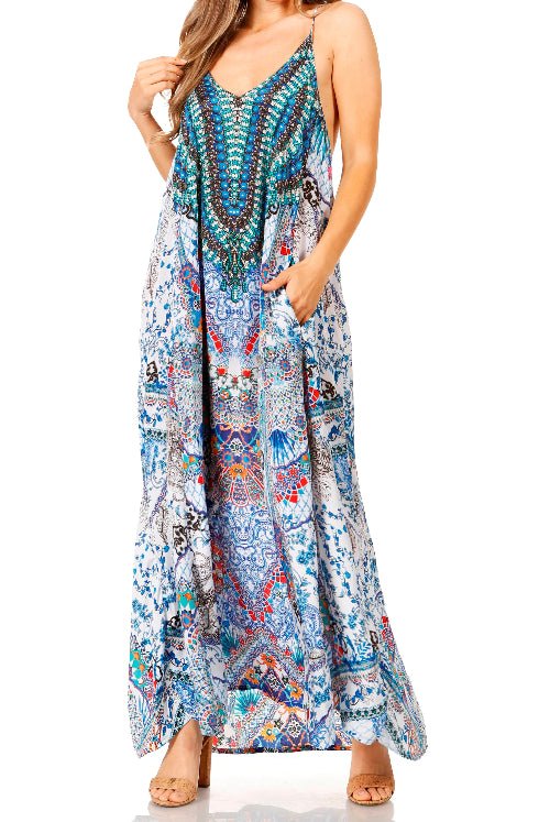 Woman wearing a colorful patterned maxi dress on a white background
