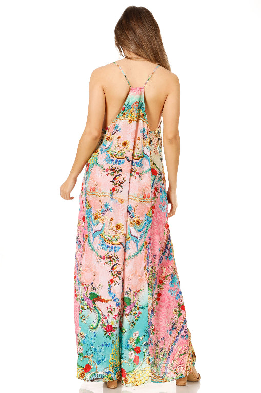 Woman wearing a colorful floral dress on a white background