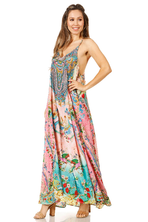 Woman wearing a colorful floral dress on a white background
