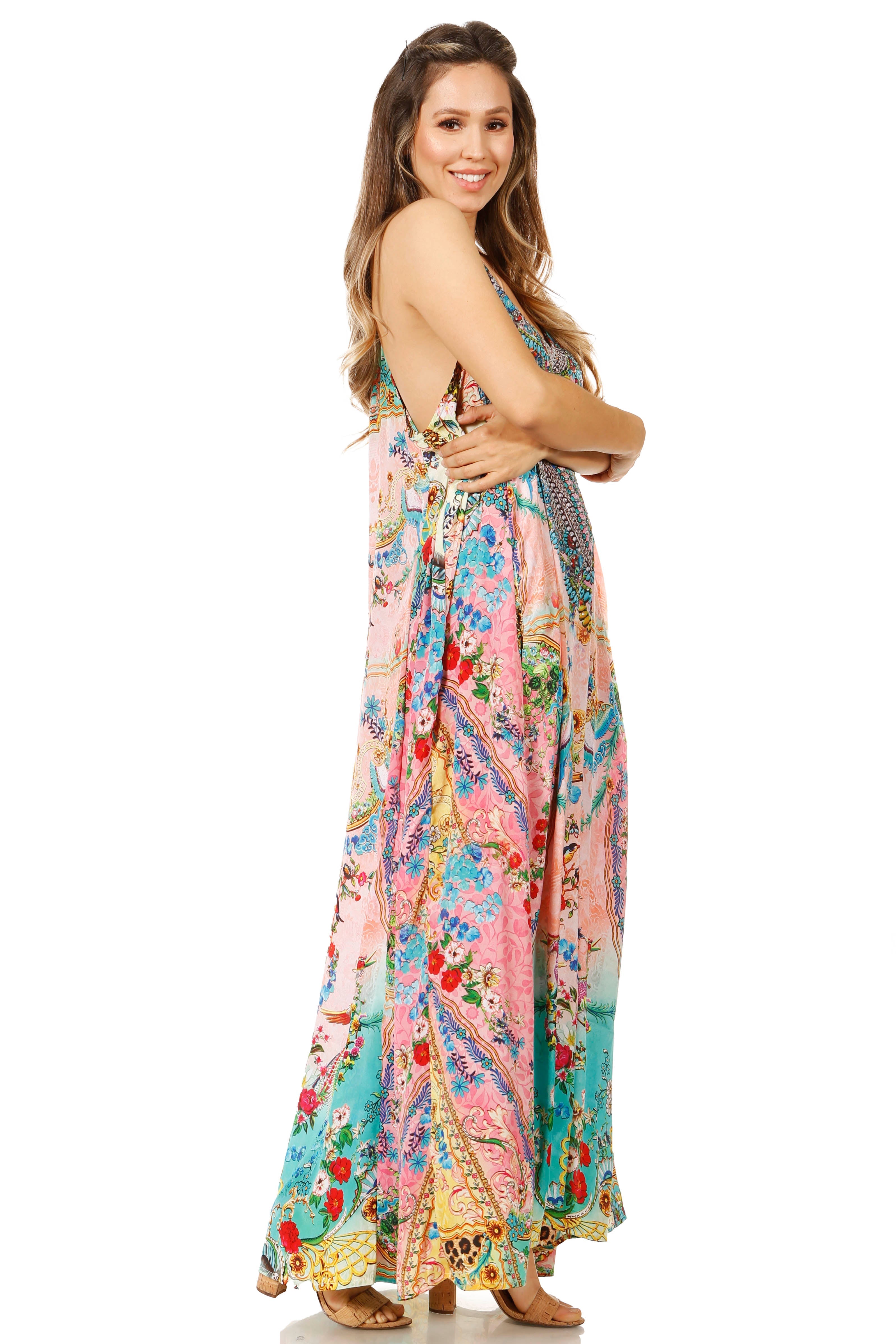 Woman wearing a colorful floral dress on a white background