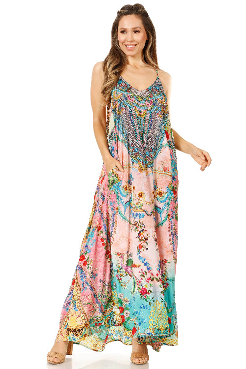 Woman wearing a colorful floral dress on a white background