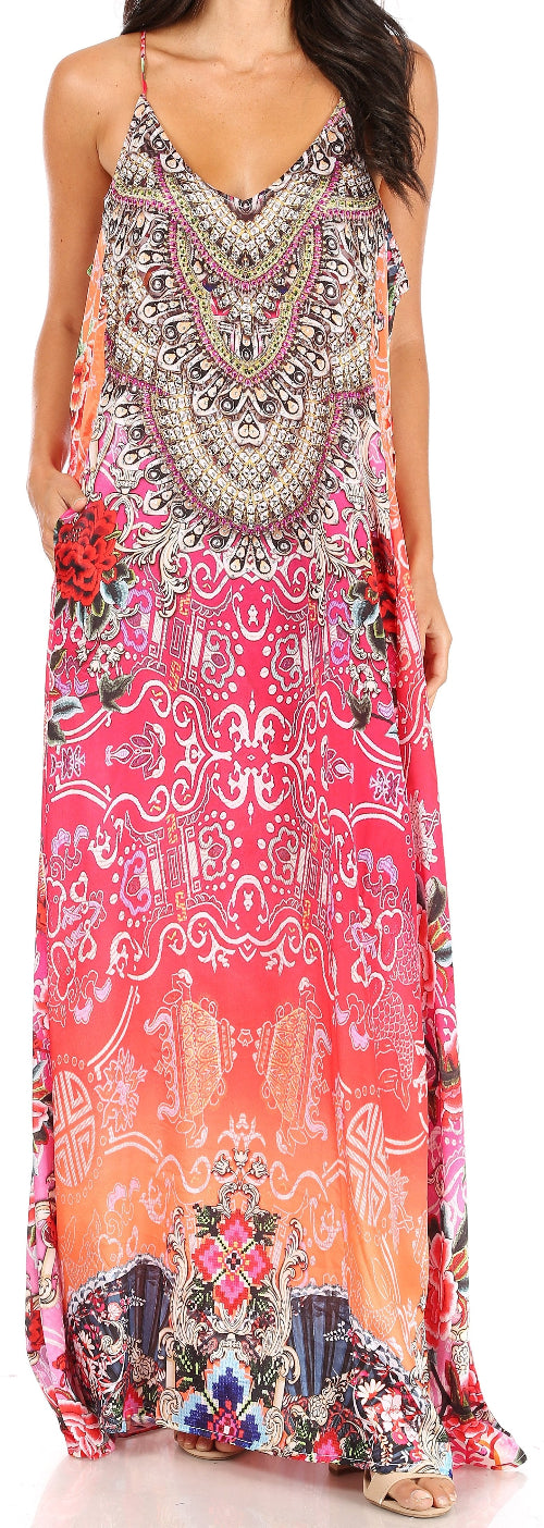 Woman wearing a colorful patterned dress with floral elements.