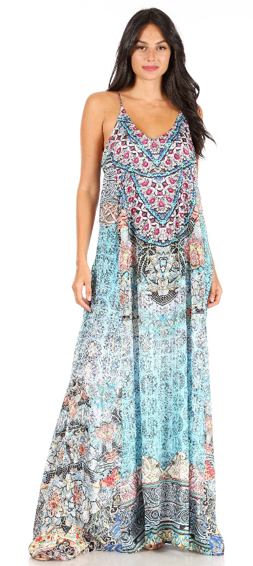 Woman wearing a colorful patterned maxi dress on a white background