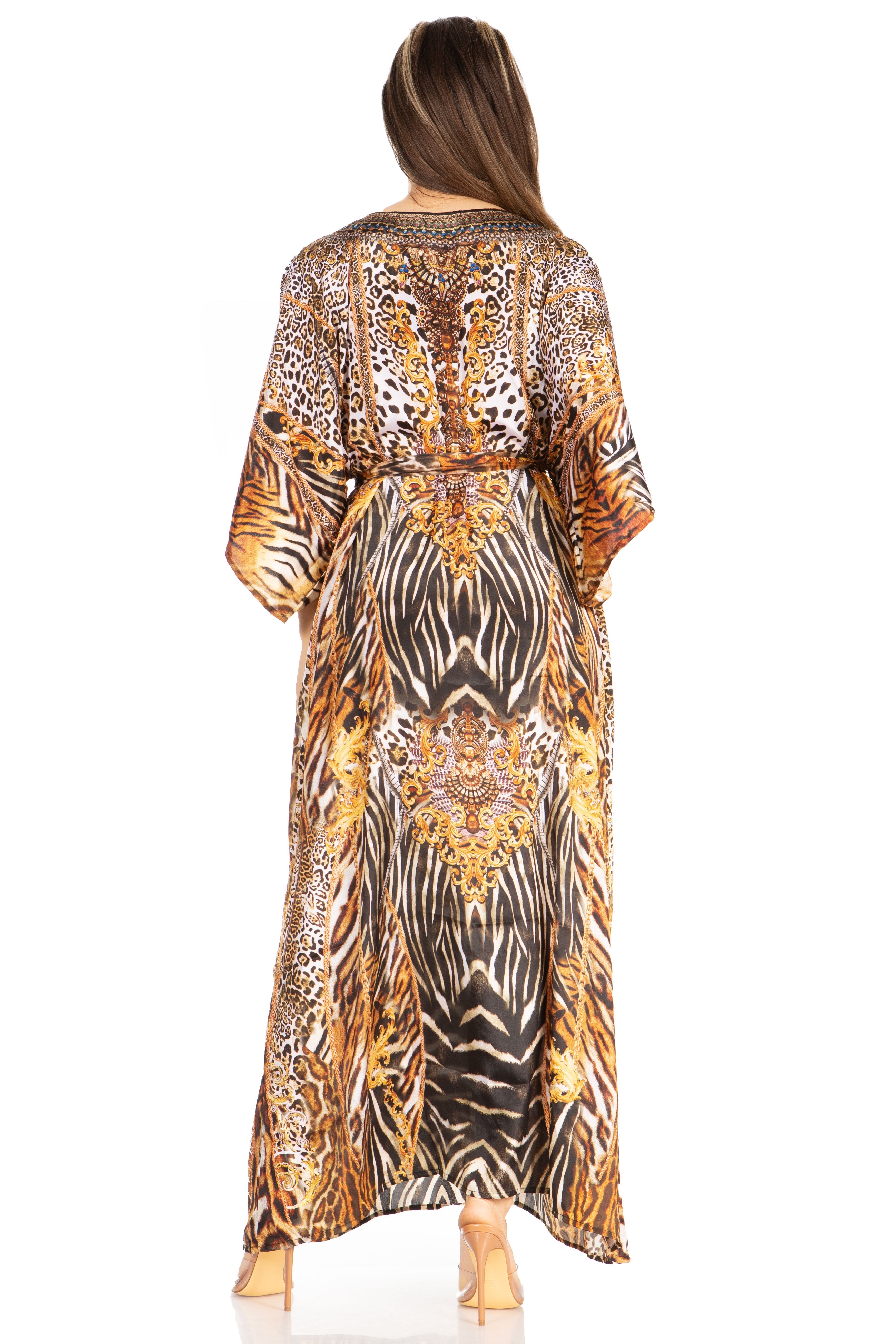 Woman wearing a long, patterned dress with a white background