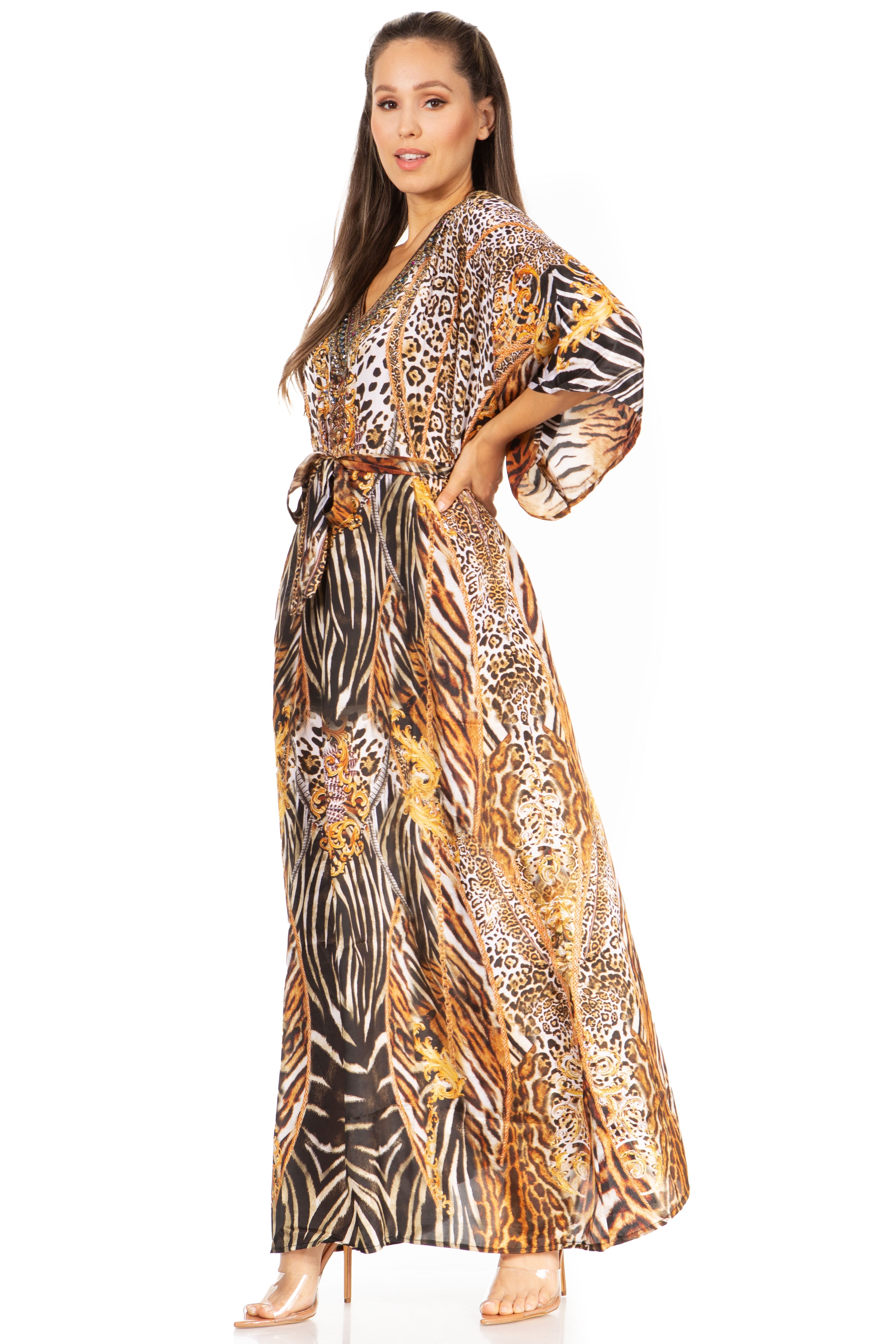Woman wearing a long, patterned dress with zebra and leopard prints on a white background