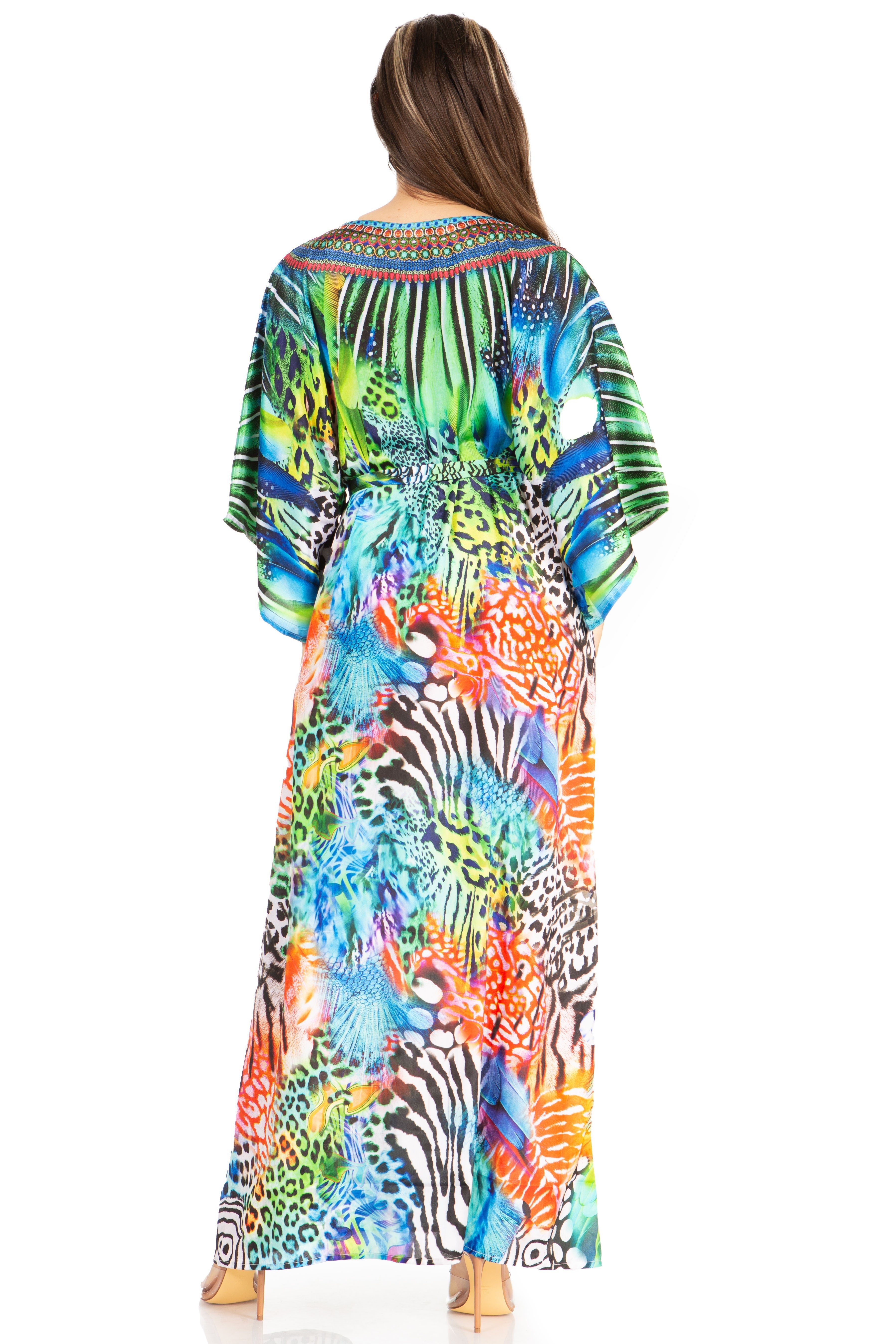 Woman wearing a colorful floral and zebra print dress on a white background