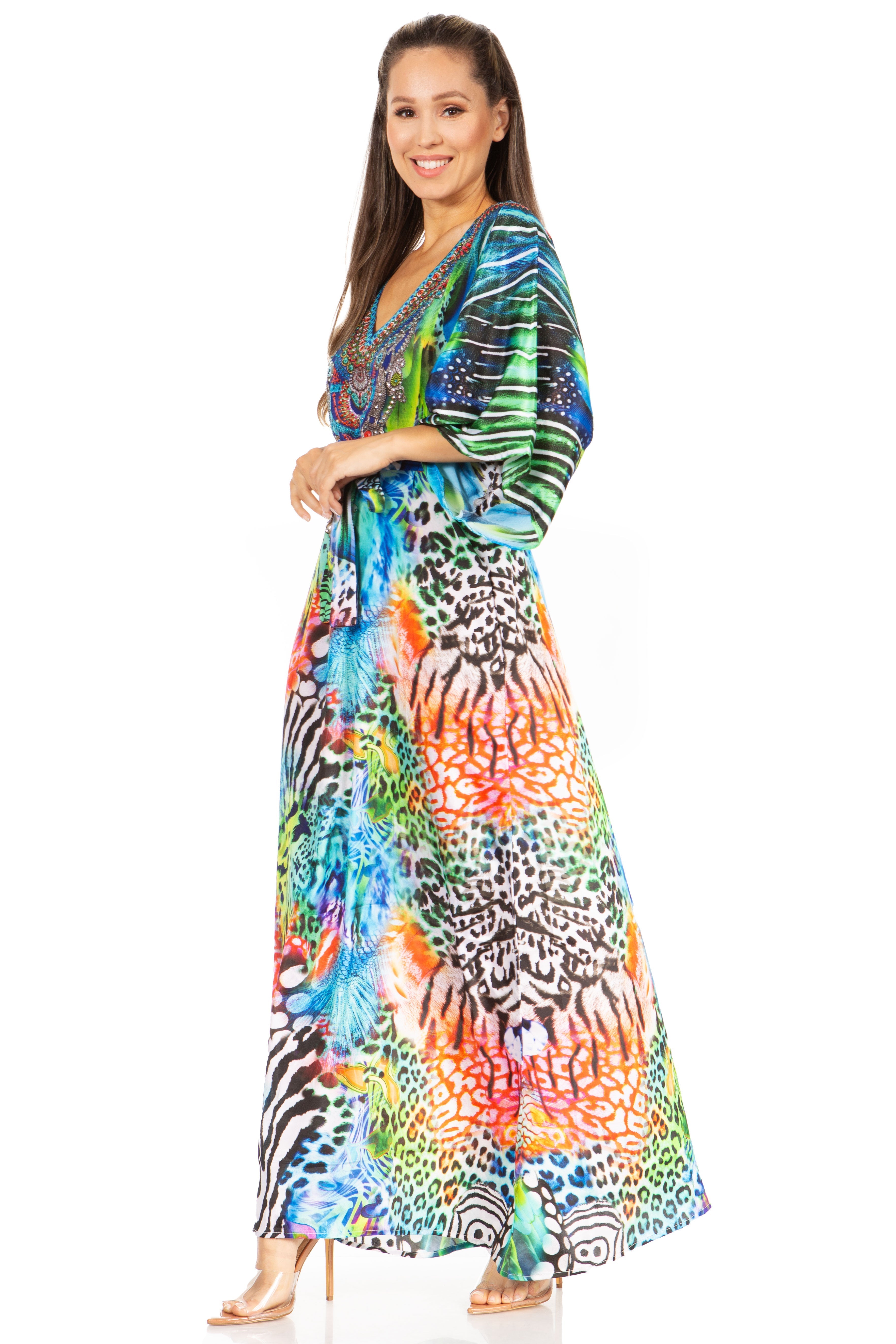 Woman wearing a colorful patterned dress on a white background