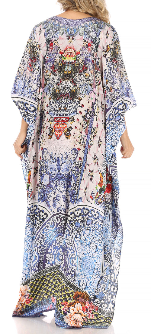 Long, patterned dress with floral and geometric designs on a white background