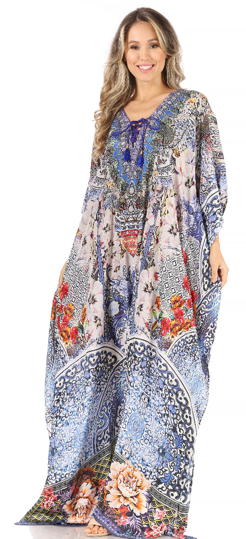 Woman wearing a long, patterned dress with floral designs on a white background